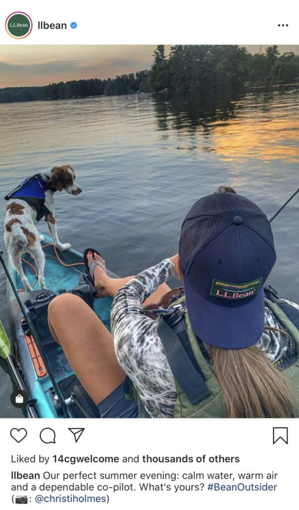 Woman in boat fishing with dog